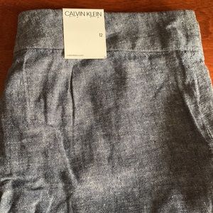 New Calvin Klein, lighter denim size 12, tags attached,pockets in front,…